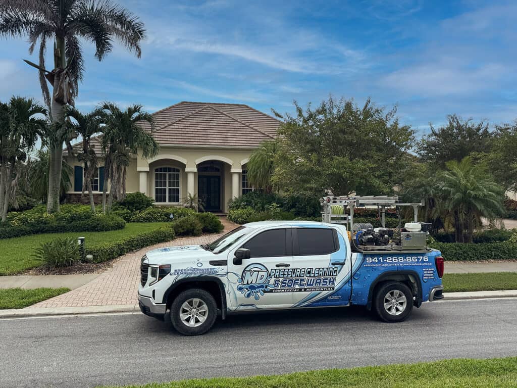 MD Pressure Cleaning & Soft Wash truck at a residential home pressure cleaning job